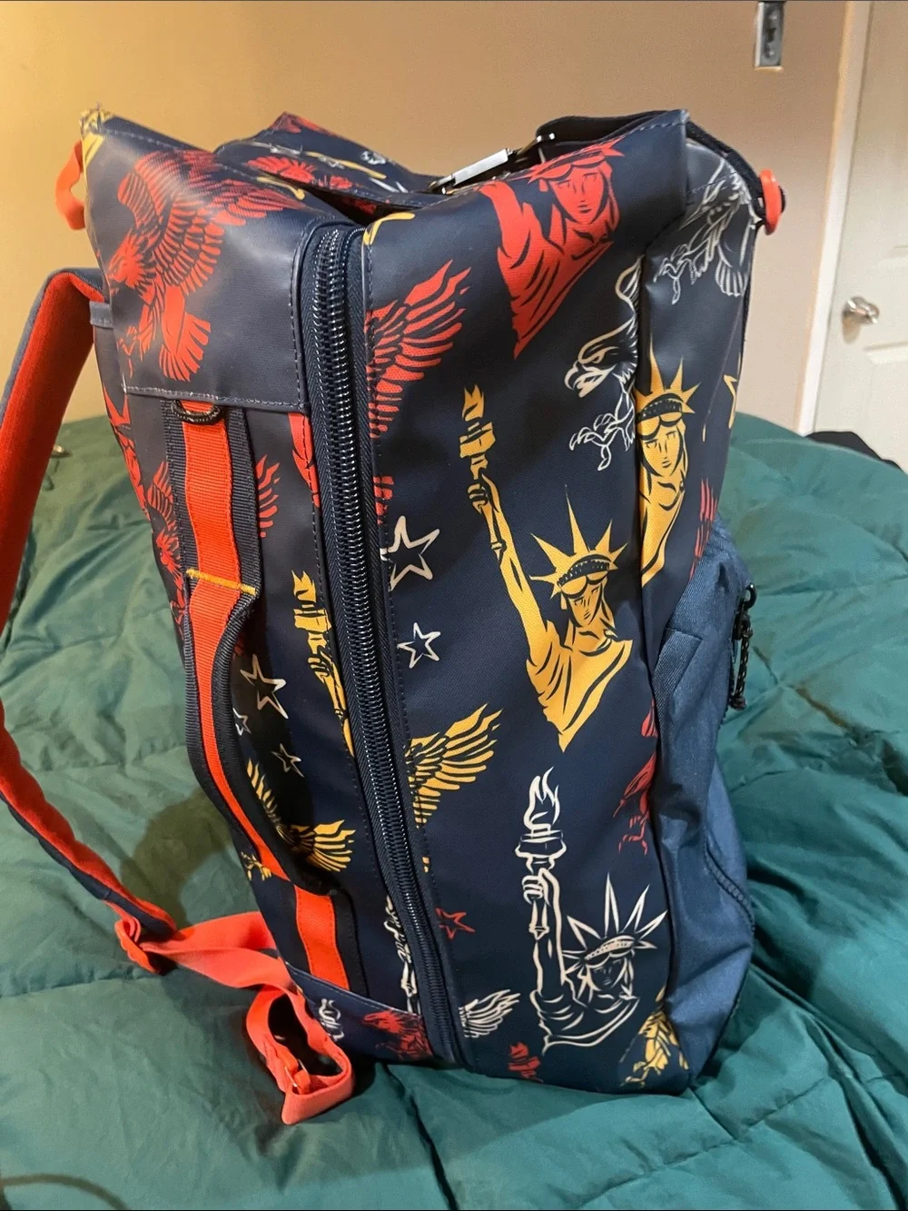 Navy Graphic Roll-Top Backpack with Red & Gold Accents